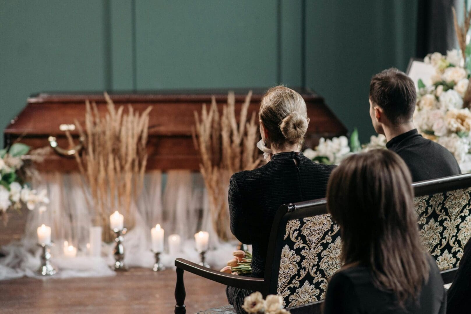 A group of people sitting in front of candles.